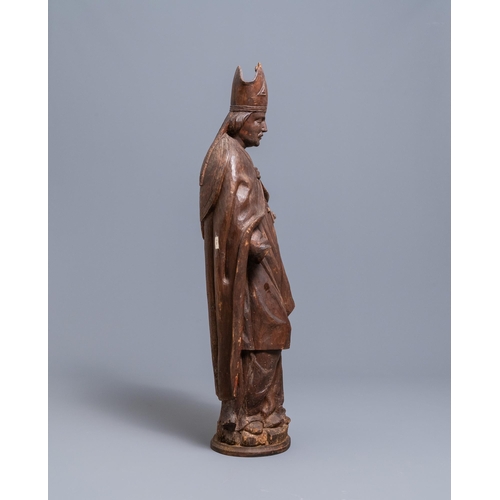 86 - A large limewood figure of a bishop, 18th C.H.: 104 cm  Provenance: - The Davioud-Larminet collectio... 