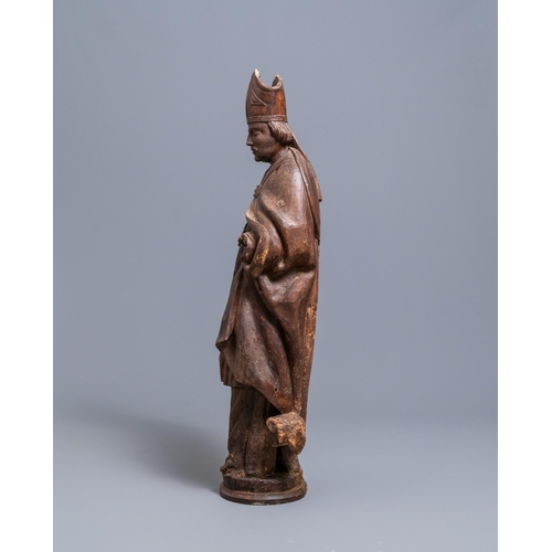 86 - A large limewood figure of a bishop, 18th C.H.: 104 cm  Provenance: - The Davioud-Larminet collectio... 