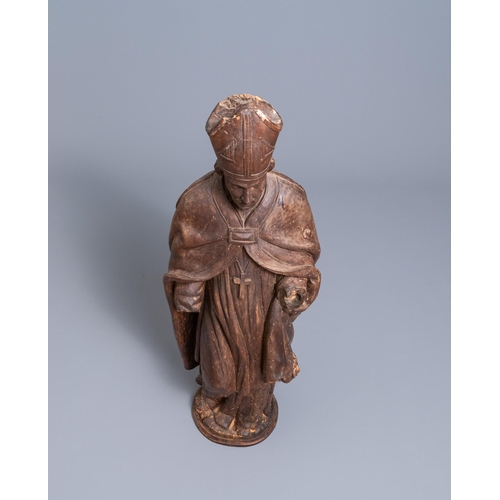 86 - A large limewood figure of a bishop, 18th C.H.: 104 cm  Provenance: - The Davioud-Larminet collectio... 