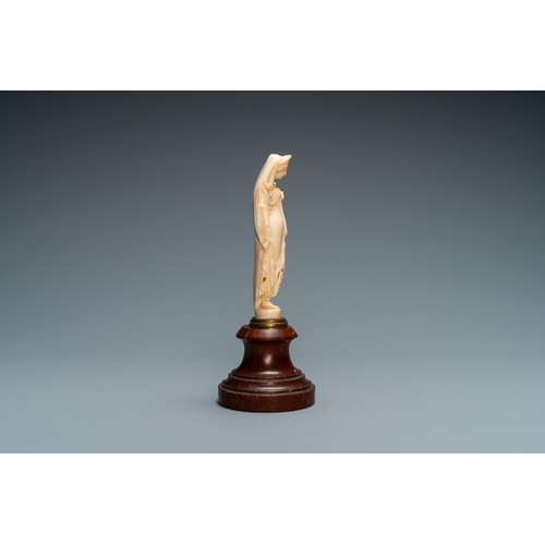 90 - An ivory figure of a woman dressed after the antique holding a vase, probably Dieppe, France, 19th C... 