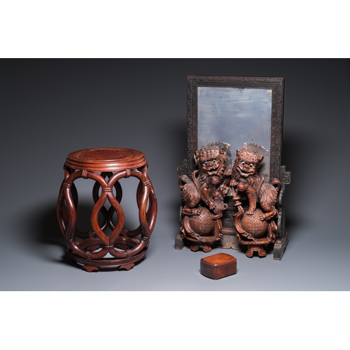 910 - A Chinese huali box and cover, a burl wood-topped stand, a table screen mirror and a pair of Buddhis... 