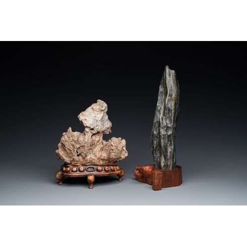 921 - Two Chinese 'gongshi or 'scholar's rocks' on wooden stands, Ming or laterH.: 34 cm (the tallest, inc... 