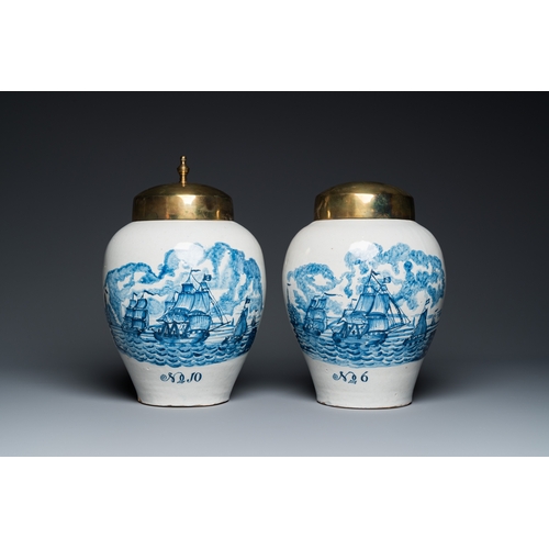 1309 - A pair of rare Dutch Delft blue and white 'maritime subject' tobacco jars with brass covers, 18th C.... 