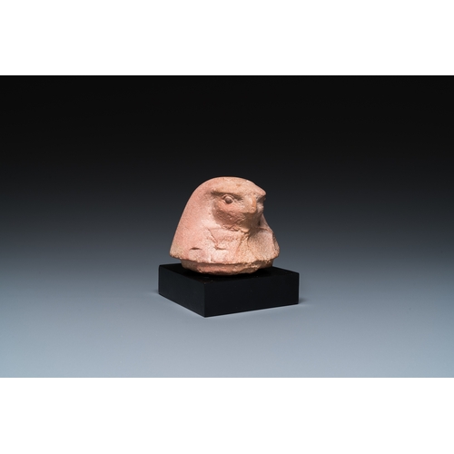 1397 - An Egyptian light brown limestone canopic lid in the shape of a falcon head, Late PeriodH.: 11 cm (i... 