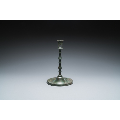 1239 - A Dutch or Flemish knotted bronze candlestick, 15th C.H.: 22,5 cm
 
 Provenance:- The collection of ... 