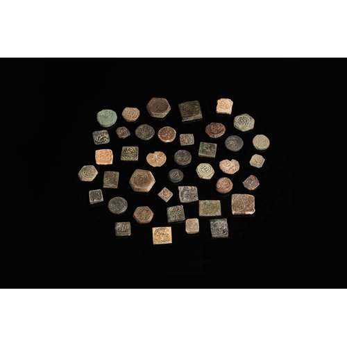 1243 - A collection of 40 copper and lead coin weights, 14/15th C.Dia.: 2,2 cm (the largest)