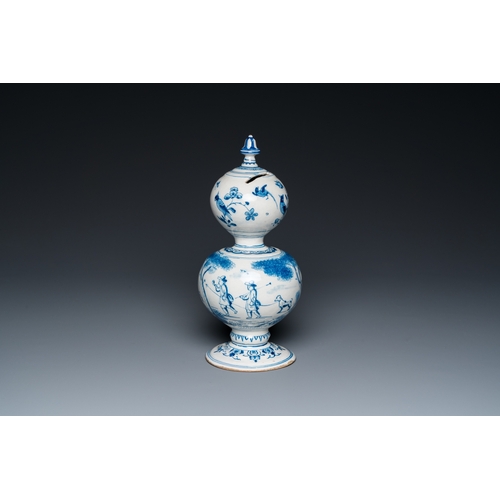 1291 - A Dutch Delft blue and white double gourd money bank with a deer hunt, dated 1732H.: 25 cm... 