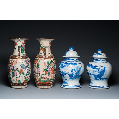 23 - A pair of Chinese blue and white covered vases and a pair of Nanking famille rose vases, 19th C.H.: ... 