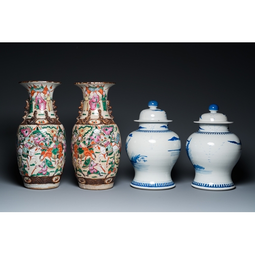 23 - A pair of Chinese blue and white covered vases and a pair of Nanking famille rose vases, 19th C.H.: ... 