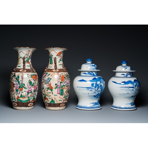 23 - A pair of Chinese blue and white covered vases and a pair of Nanking famille rose vases, 19th C.H.: ... 