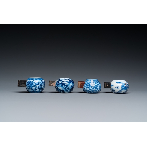 25 - Four Chinese blue, white and copper-red bird feeders, 19th C.L.: 6 cm - H.: 3 cm (the largest incl. ... 