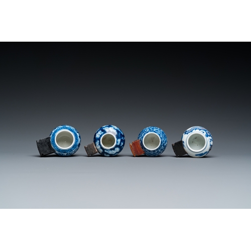 25 - Four Chinese blue, white and copper-red bird feeders, 19th C.L.: 6 cm - H.: 3 cm (the largest incl. ... 