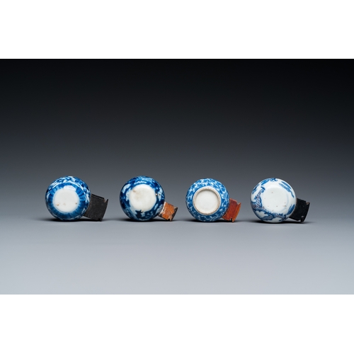 25 - Four Chinese blue, white and copper-red bird feeders, 19th C.L.: 6 cm - H.: 3 cm (the largest incl. ... 