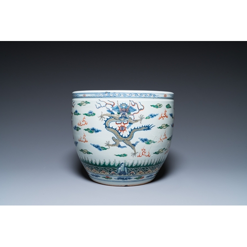 47 - A Chinese blue and white celadon-ground vase, a pair of Nanking vases and a famille verte fish bowl,... 