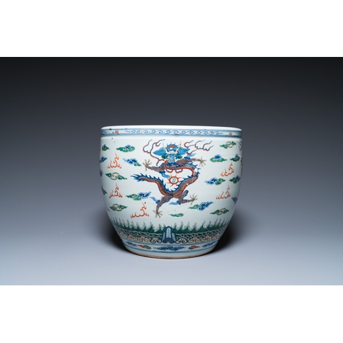 47 - A Chinese blue and white celadon-ground vase, a pair of Nanking vases and a famille verte fish bowl,... 