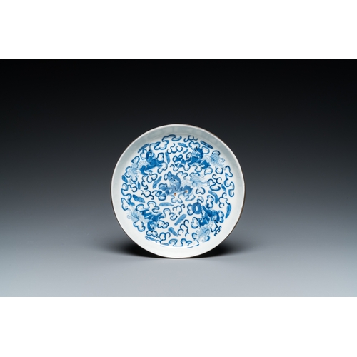 57 - Four Chinese blue and white 'Buddhist lions' cups and their round tray, Shun Li Kin Ji mark, 19th C.... 