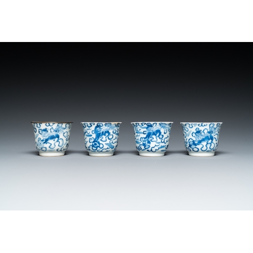 57 - Four Chinese blue and white 'Buddhist lions' cups and their round tray, Shun Li Kin Ji mark, 19th C.... 