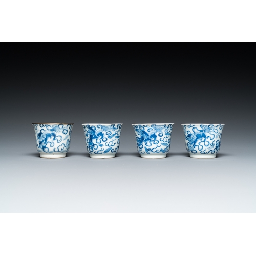 57 - Four Chinese blue and white 'Buddhist lions' cups and their round tray, Shun Li Kin Ji mark, 19th C.... 