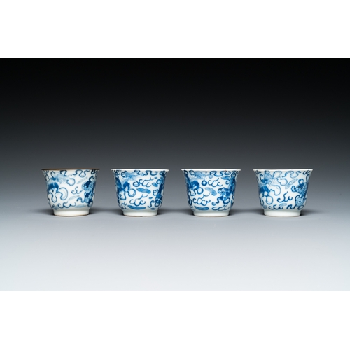 57 - Four Chinese blue and white 'Buddhist lions' cups and their round tray, Shun Li Kin Ji mark, 19th C.... 