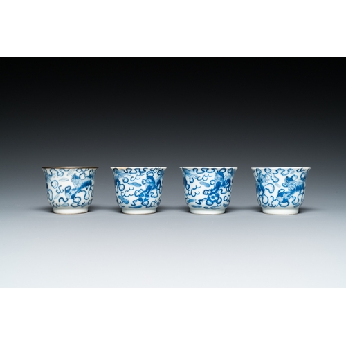 57 - Four Chinese blue and white 'Buddhist lions' cups and their round tray, Shun Li Kin Ji mark, 19th C.... 