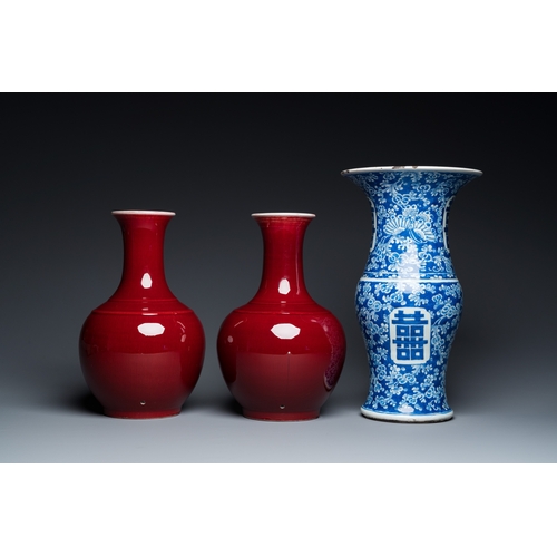 72 - A Chinese blue and white 'Shou' vase with butterflies and a pair of sang-de-boeuf-glazed bottle vase... 