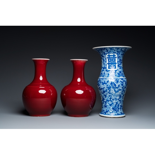 72 - A Chinese blue and white 'Shou' vase with butterflies and a pair of sang-de-boeuf-glazed bottle vase... 