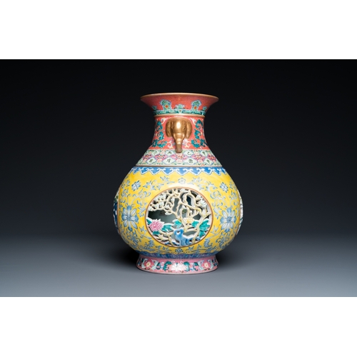 75 - A Chinese reticulated and revolving famille rose vase consisting of two parts, Qianlong mark, 20th C... 