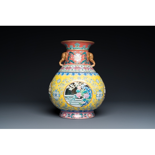 75 - A Chinese reticulated and revolving famille rose vase consisting of two parts, Qianlong mark, 20th C... 