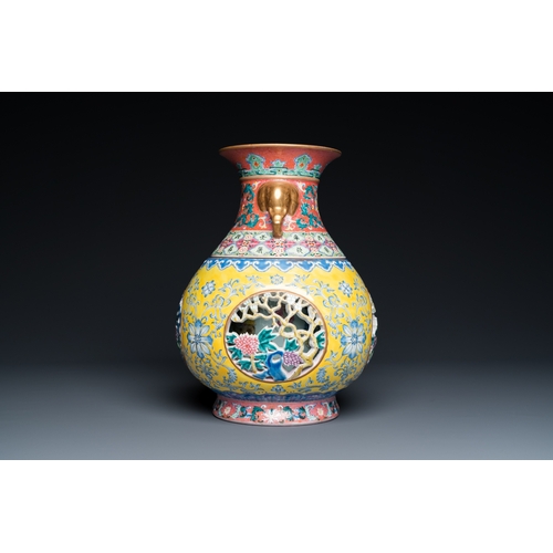 75 - A Chinese reticulated and revolving famille rose vase consisting of two parts, Qianlong mark, 20th C... 