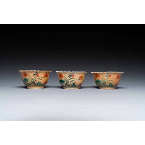 77 - Three Chinese Kangxi-style cafe-au-lait-ground famille verte cups and saucers, rabbit mark, 19th C.D... 