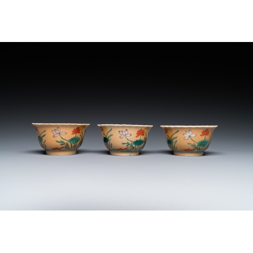 77 - Three Chinese Kangxi-style cafe-au-lait-ground famille verte cups and saucers, rabbit mark, 19th C.D... 