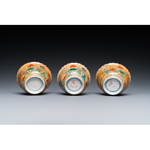 77 - Three Chinese Kangxi-style cafe-au-lait-ground famille verte cups and saucers, rabbit mark, 19th C.D... 