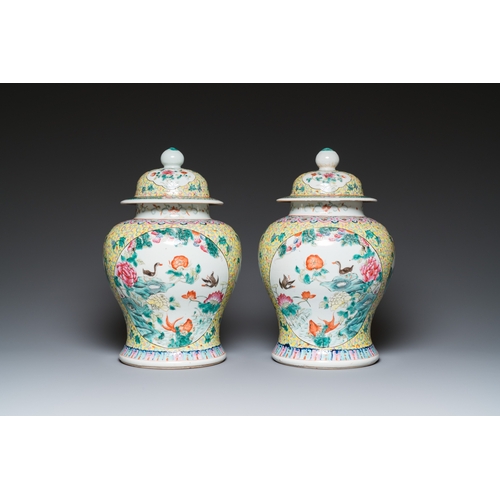 9 - A pair of Chinese famille rose covered vases and a jardiniere, 19/20th C.H.: 41,5 cm (incl. stand) -... 