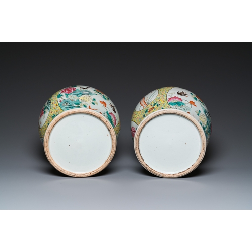 9 - A pair of Chinese famille rose covered vases and a jardiniere, 19/20th C.H.: 41,5 cm (incl. stand) -... 