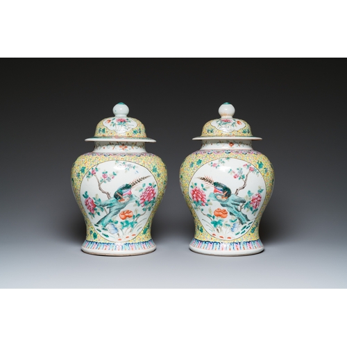 9 - A pair of Chinese famille rose covered vases and a jardiniere, 19/20th C.H.: 41,5 cm (incl. stand) -... 