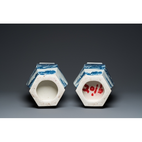 100 - A pair of Chinese blue and white hexagonal 'mountainous landscape' vases, 19th C.H.: 61 cm... 