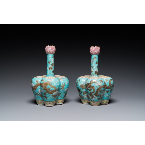 132 - A pair of Chinese famille rose turquoise-ground flower vases with dragons, 19th C.H.: 28 cm... 