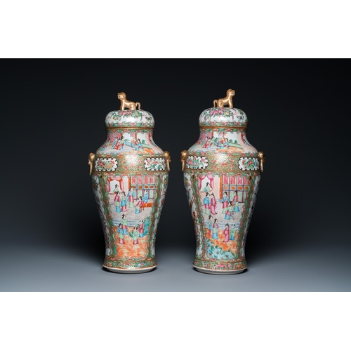 156 - A pair of Chinese Canton famille rose vases and covers, 19th C.H.: 51 cm