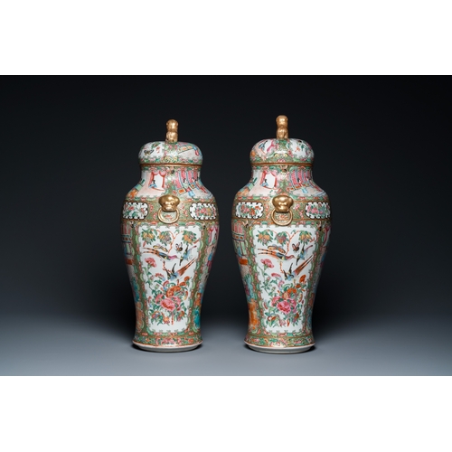 156 - A pair of Chinese Canton famille rose vases and covers, 19th C.H.: 51 cm