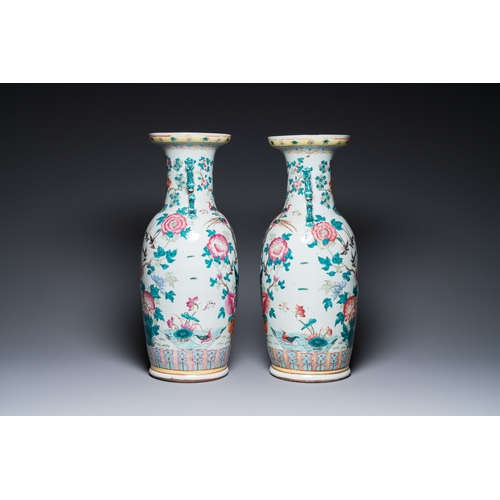 180 - A pair of Chinese famille rose vases with peacocks and phoenixes, 19th C.H.: 60 cm