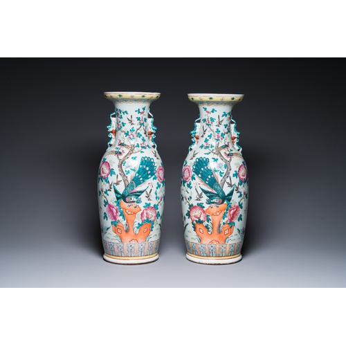 180 - A pair of Chinese famille rose vases with peacocks and phoenixes, 19th C.H.: 60 cm