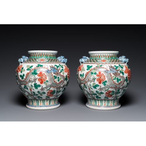 184 - A pair of Chinese famille verte 'dragon' vases, Chenghua mark, 19th C.H.: 37 cm (incl. the stands an... 