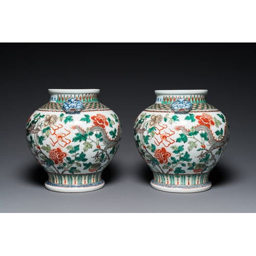 184 - A pair of Chinese famille verte 'dragon' vases, Chenghua mark, 19th C.H.: 37 cm (incl. the stands an... 