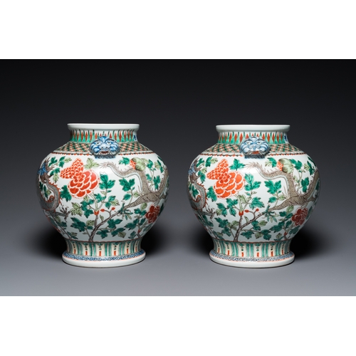 184 - A pair of Chinese famille verte 'dragon' vases, Chenghua mark, 19th C.H.: 37 cm (incl. the stands an... 