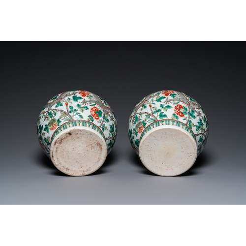 184 - A pair of Chinese famille verte 'dragon' vases, Chenghua mark, 19th C.H.: 37 cm (incl. the stands an... 