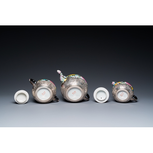 196 - A Chinese eight-piece silver-mounted famille rose millefleurs tea service, Qianlong mark 20th C.H.: ... 