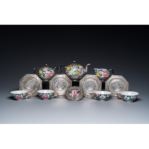 196 - A Chinese eight-piece silver-mounted famille rose millefleurs tea service, Qianlong mark 20th C.H.: ... 