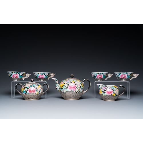 196 - A Chinese eight-piece silver-mounted famille rose millefleurs tea service, Qianlong mark 20th C.H.: ... 