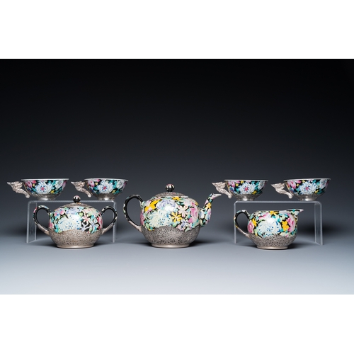 196 - A Chinese eight-piece silver-mounted famille rose millefleurs tea service, Qianlong mark 20th C.H.: ... 