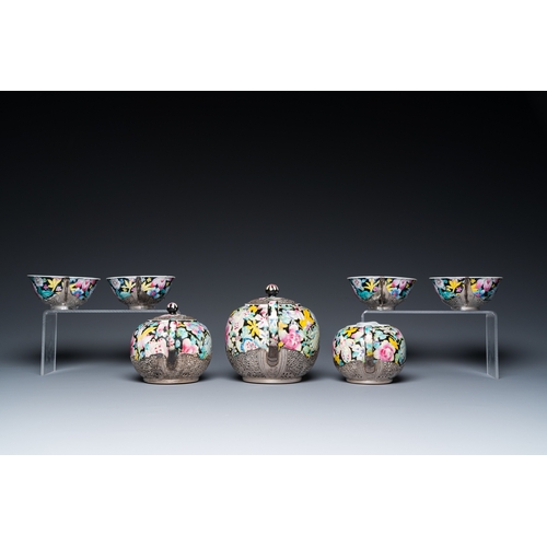 196 - A Chinese eight-piece silver-mounted famille rose millefleurs tea service, Qianlong mark 20th C.H.: ... 